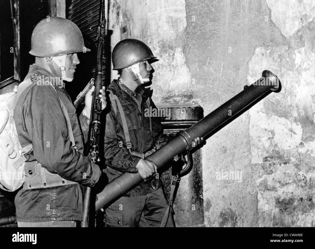 Mexico City: Mexican Army troops prepare to fire bazooka shell through a door of a student 'fortress.' Troops broke up student Stock Photo