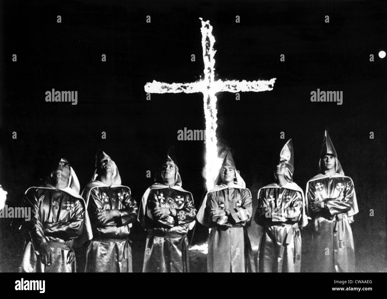9/5/71--STONE MOUNTAIN, GA: Six unidentified Ku Klux Klan members in front of the traditional burning cross at a rally billed Stock Photo