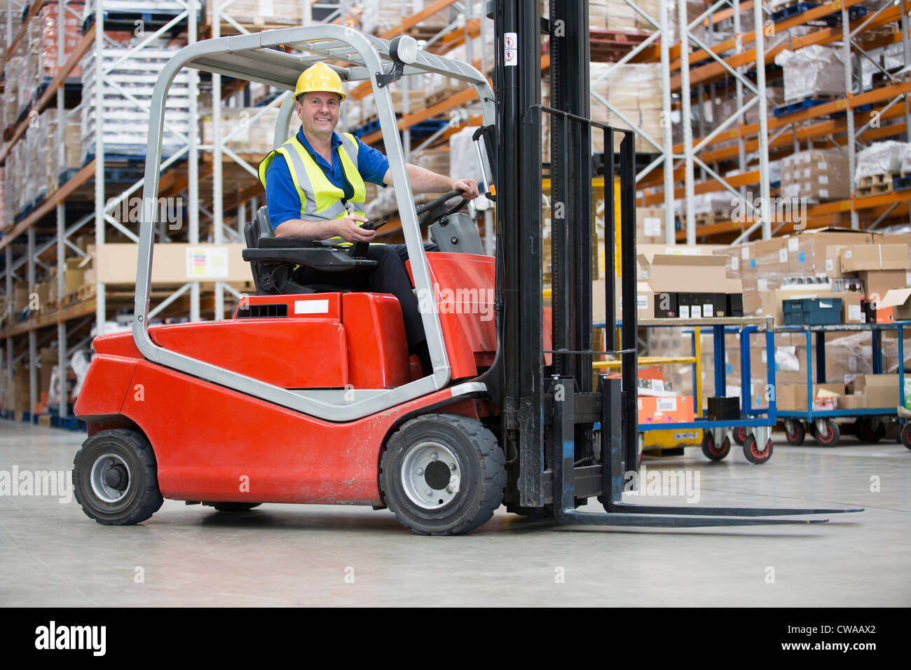 Man driving forklift truck Stock Photo Alamy