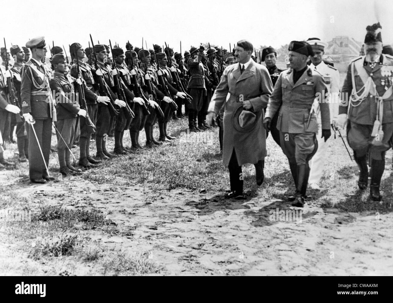 Adolf Hitler and Benito Mussolini as they inspect Italian Blackshirts shorty after Hilter's arrival in Venice, Italy. August Stock Photo