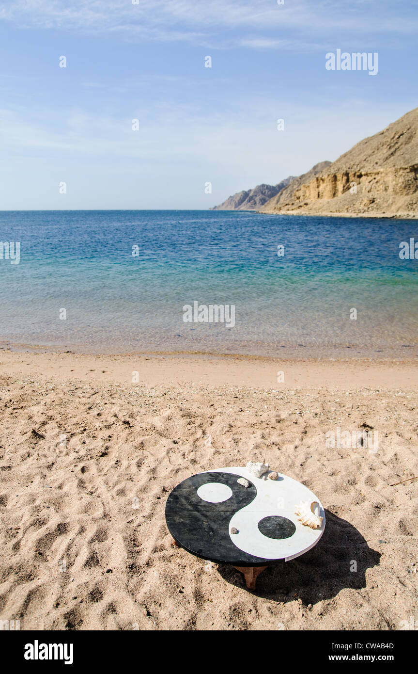 landscape wit the symbol of Yin Yang on the beach Stock Photo