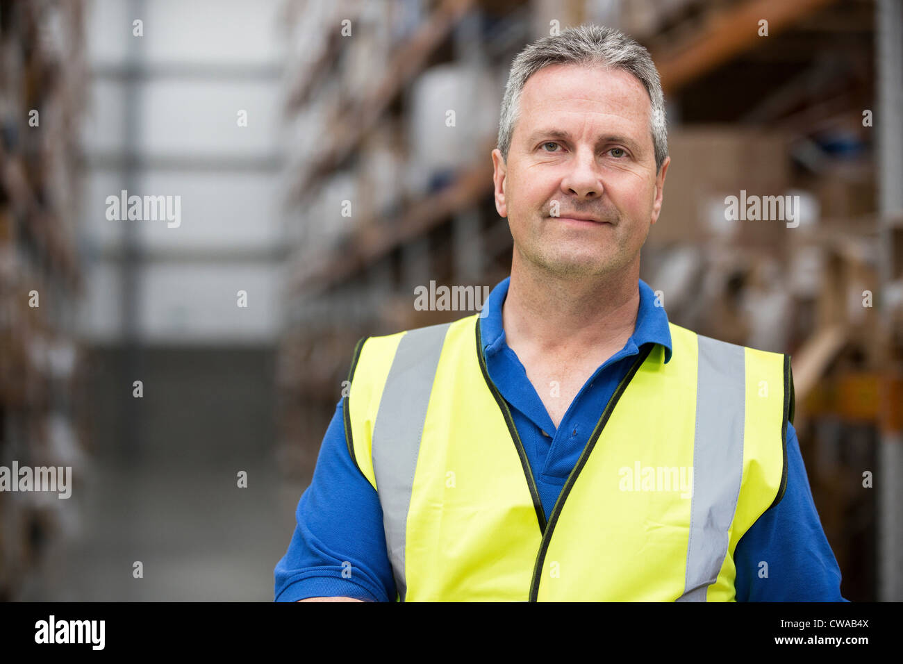 Man wearing high visibility clothing in warehouse, portrait Stock Photo