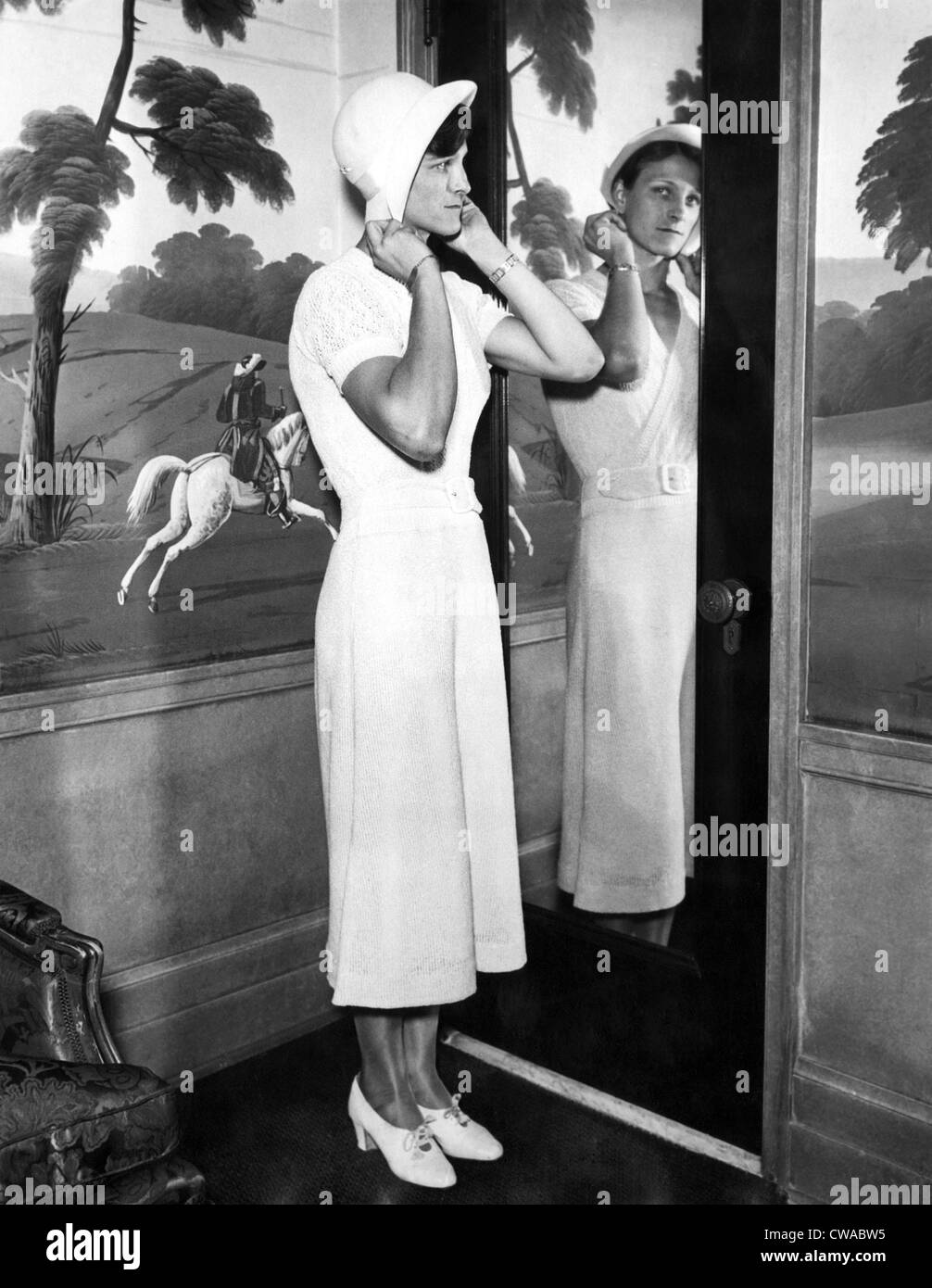 American Olympic athlete Babe Didrikson, (aka Babe Zaharias), (1911-1956), trying on a hat in her hotel room in Chicago, Stock Photo