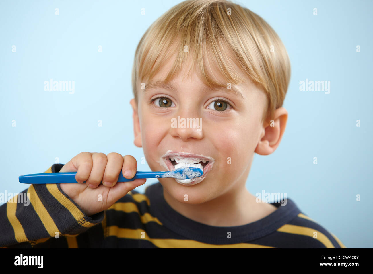 Boy brushing teeth Stock Photo