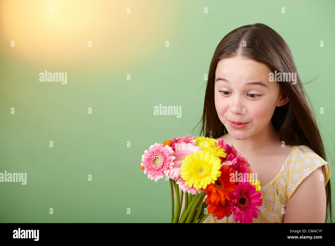 Girl with bunch of flowers Stock Photo