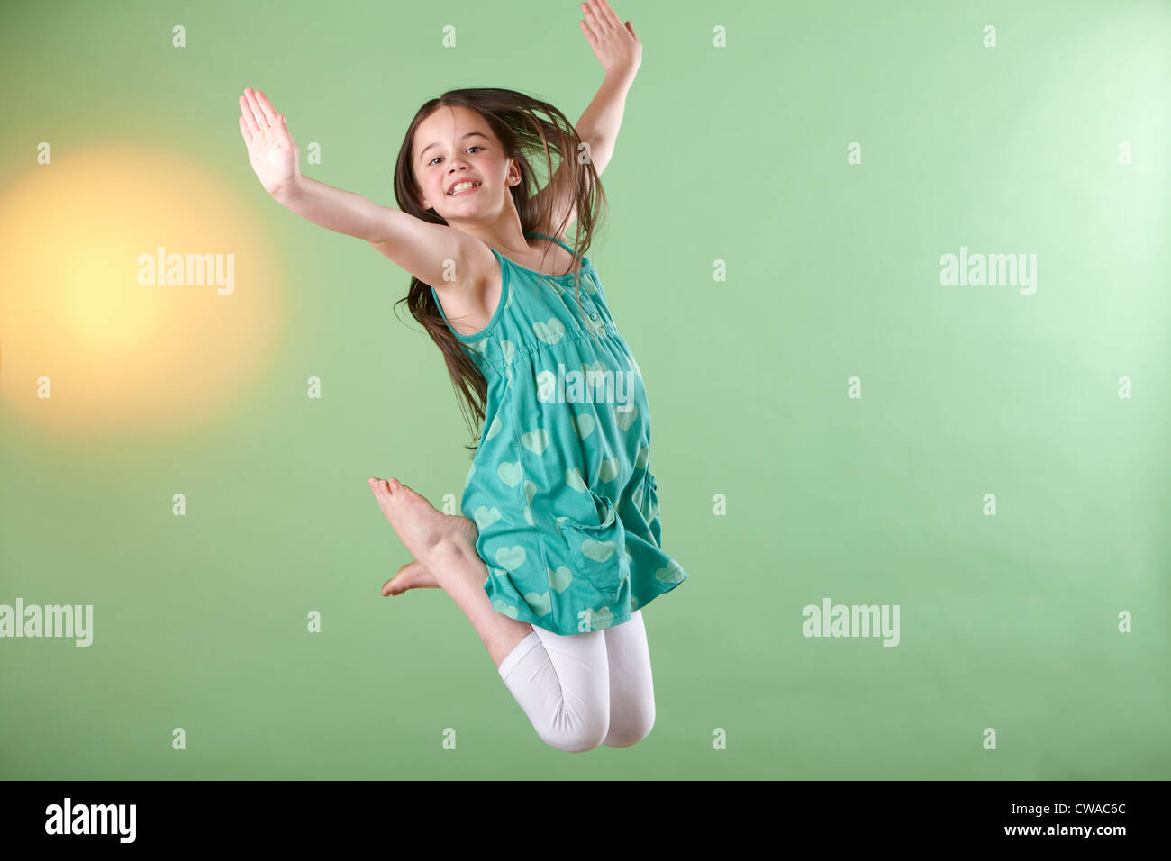 Girl jumping, mid air Stock Photo