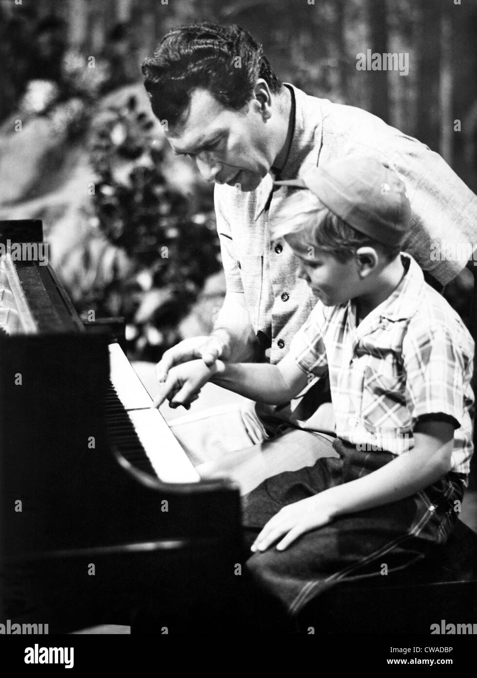 Dave Brubeck teaching his son play piano ca.1950s Stock Photo