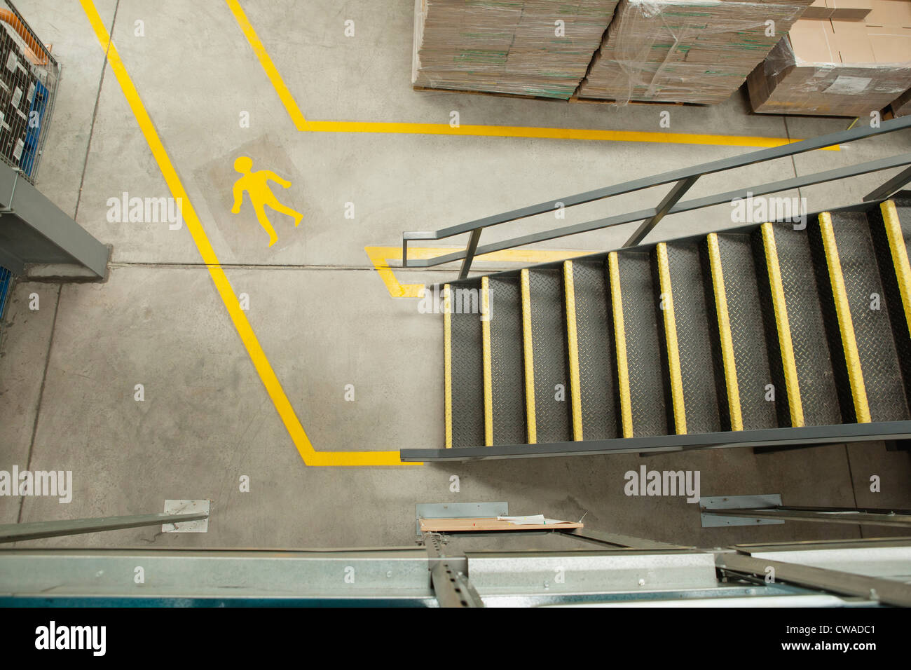 Steps and yellow lines in warehouse, elevated view Stock Photo