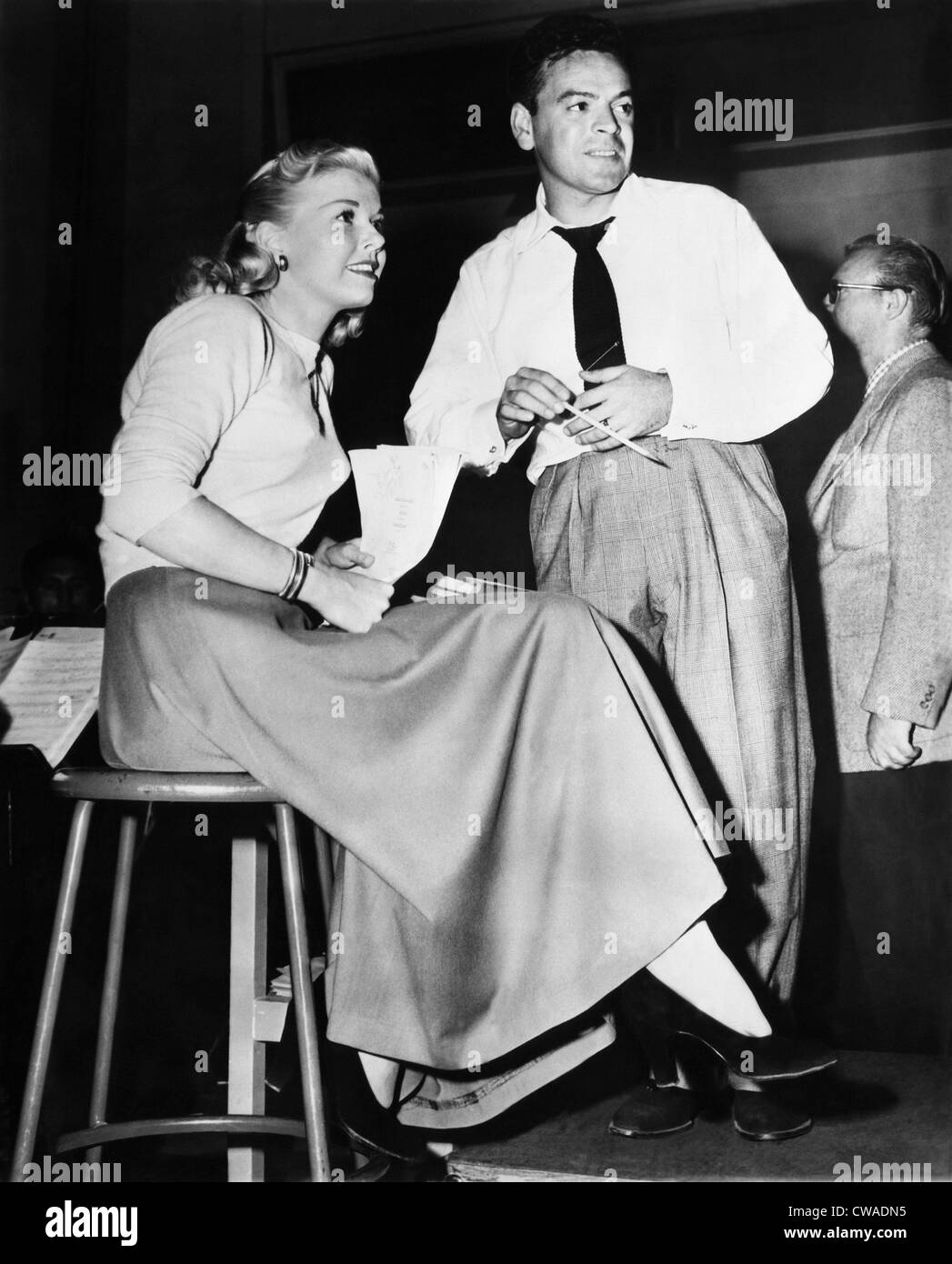 Bandleader Les Brown (holding pencil) with the band's female singer Doris Day (left), ca. late 1940s. Courtesy: CSU Archives / Stock Photo