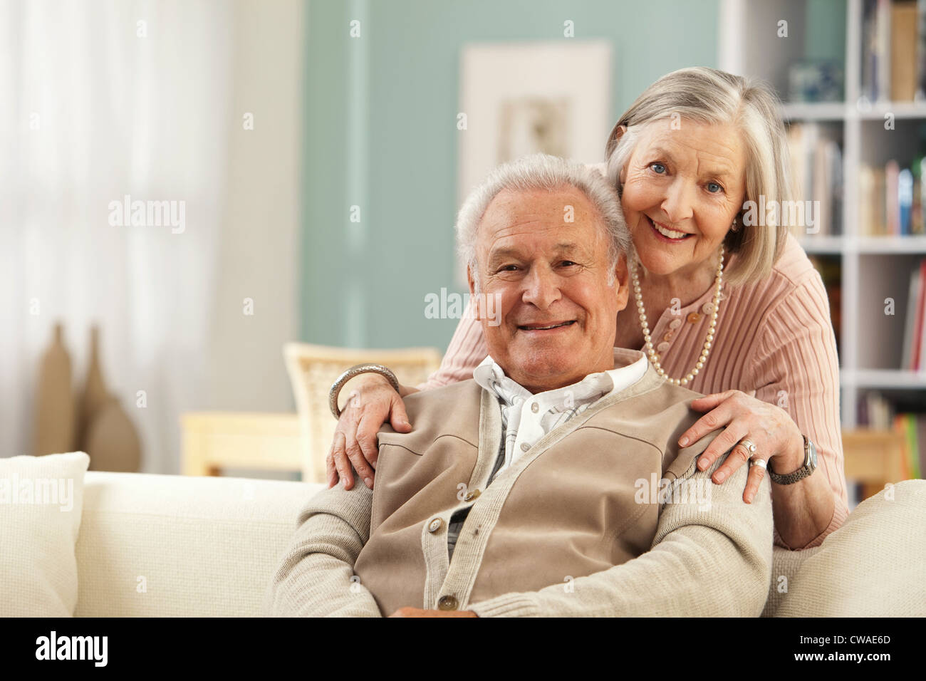 Senior woman with hands on mans shoulders Stock Photo