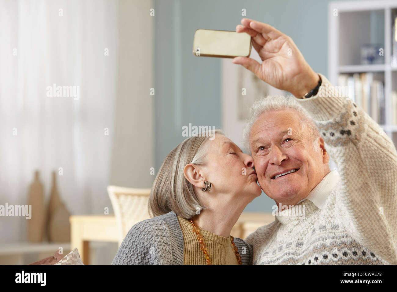 Young man kissing older woman hi-res stock photography and images - Alamy
