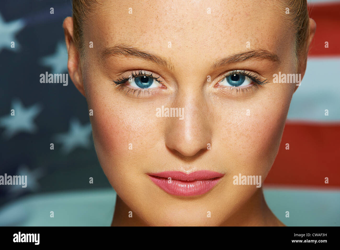 Young woman in front of USA flag Stock Photo