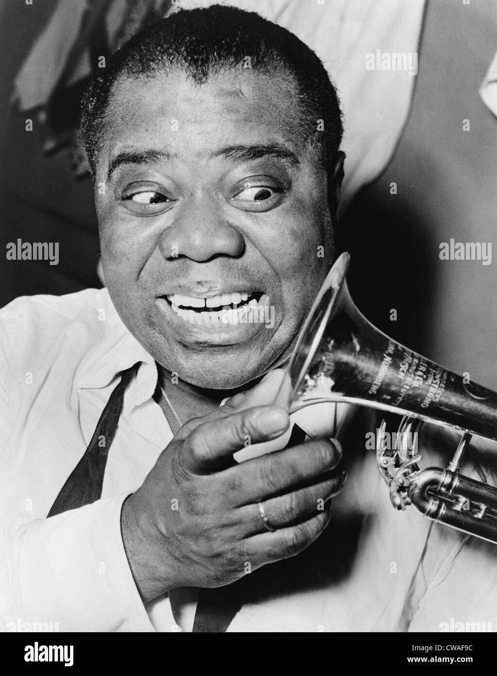 Louis Armstrong (1901-1971), African American Jazz musician, with his trademark smile and trumpet, 1953. Stock Photo