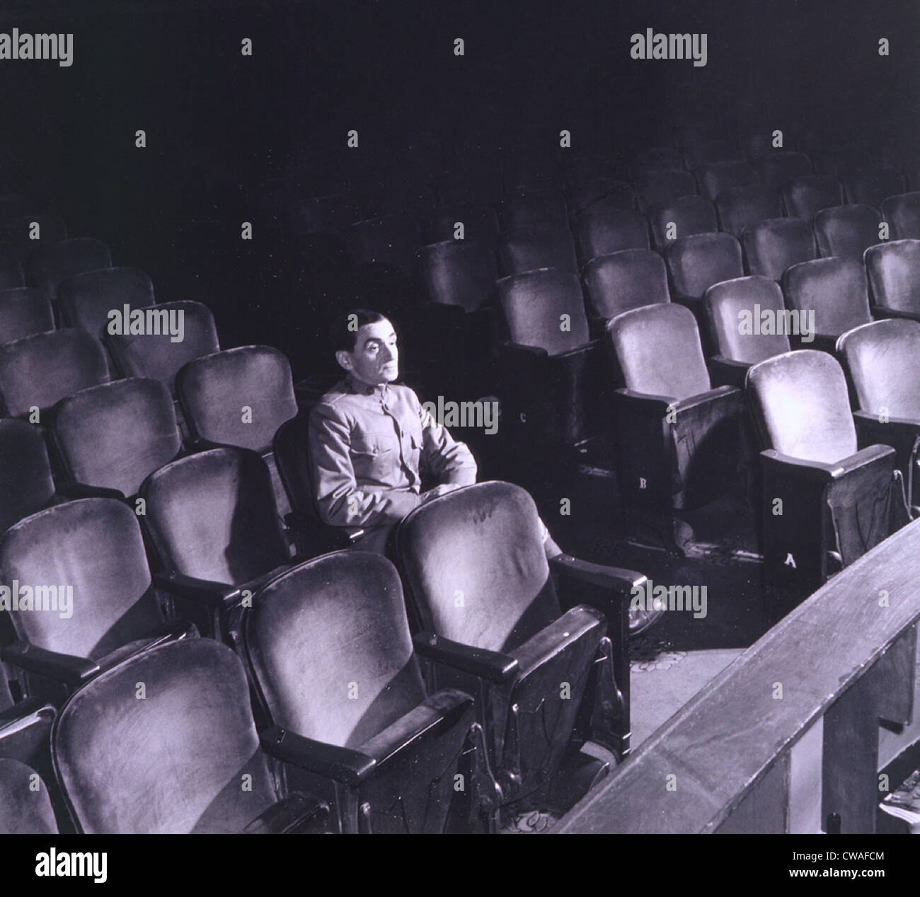 Irving Berlin (1888-1989), seated alone in auditorium in 1942.  In addition to theatrical hits, Berlin's film credits include: Stock Photo