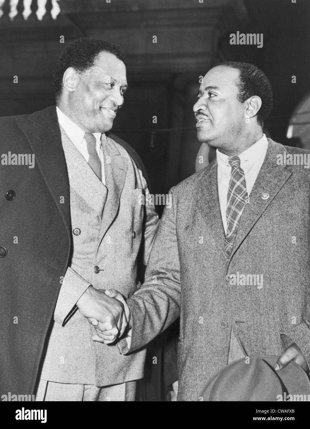 Paul Robeson (1898-1976), shaking hands with New York City Councilman Ben  Davis (1903-1964), in Union Square during May Day Stock Photo - Alamy