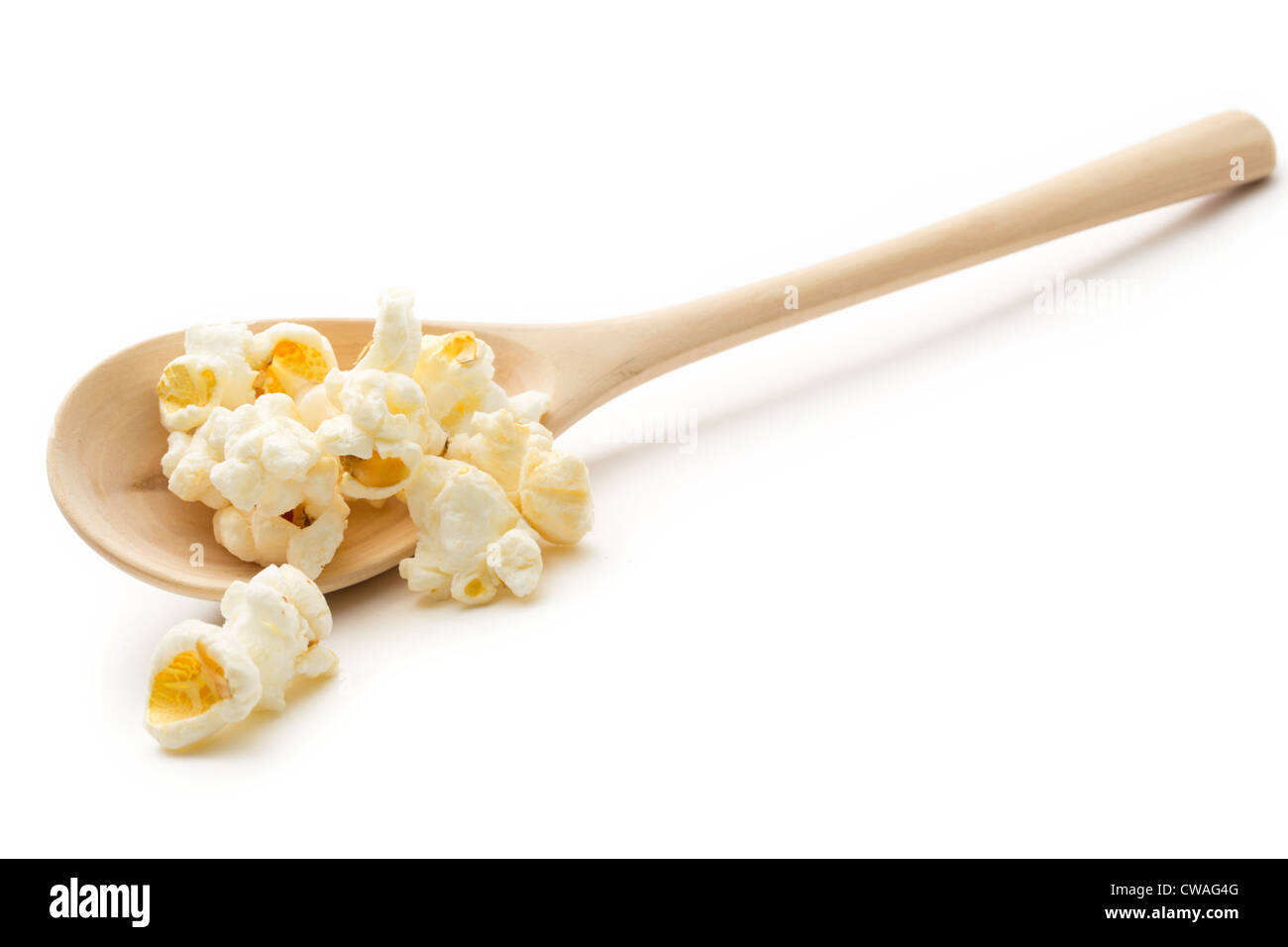 Popcorn on the wooden spoon Stock Photo Alamy