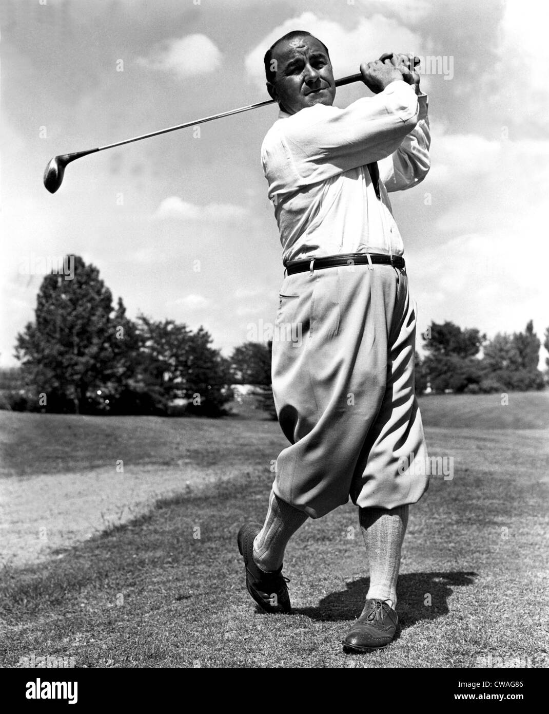 Golfer GENE SARAZEN takes a swing, 7/21/54. Courtesy: CSU Archives / Everett Collection Stock Photo