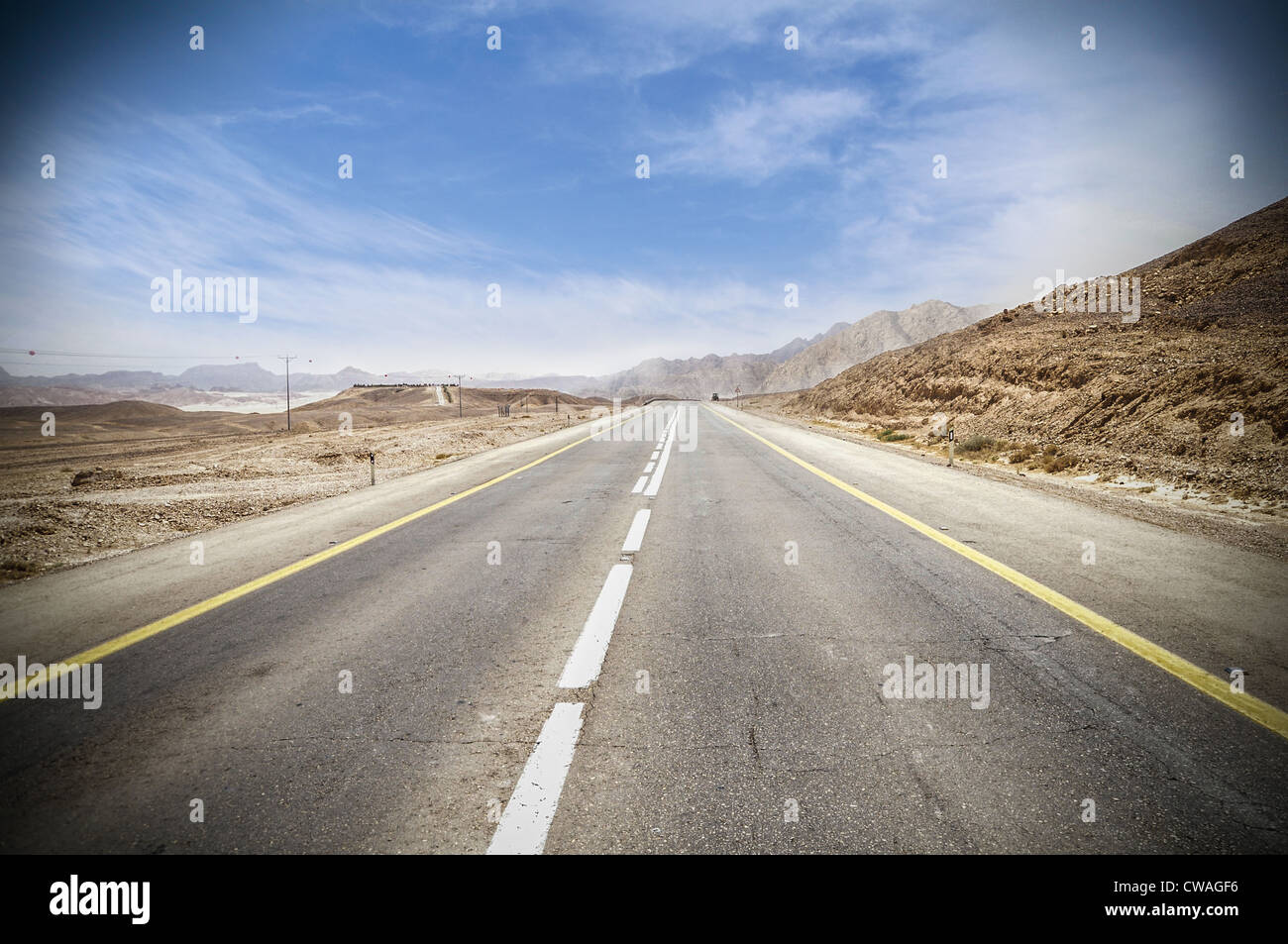 empty highway surrounded by hills in Arava desert Stock Photo - Alamy