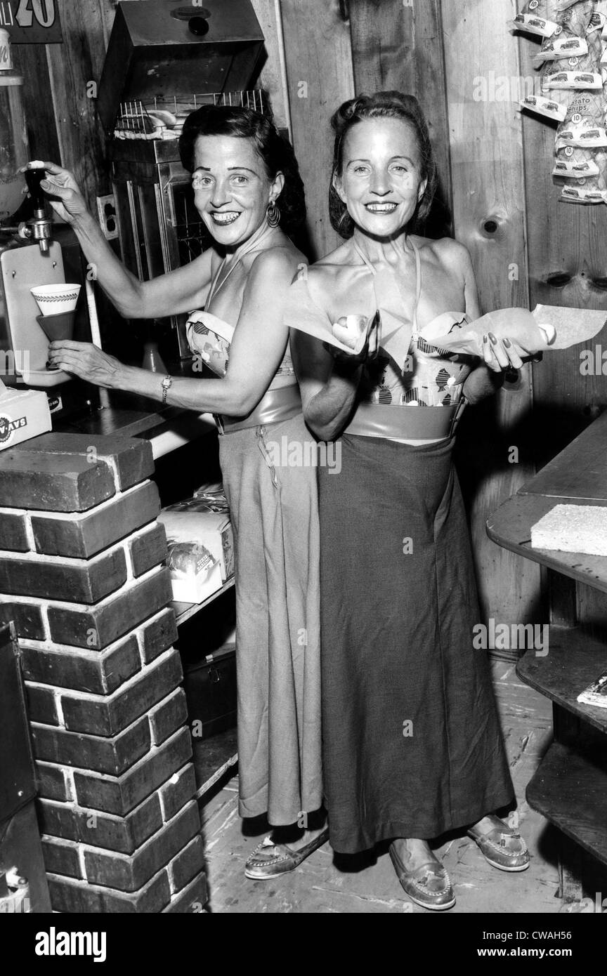 Conjoined twins Violet and Daisy Hilton offer service on the snack bar they purchased in Miami. June 1955. Courtesy CSU Stock Photo