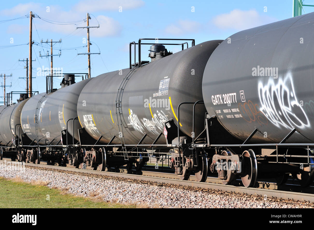 Bartlett, Illinois, USA. Freight train made up of tank cars heading east to Chicago. Stock Photo