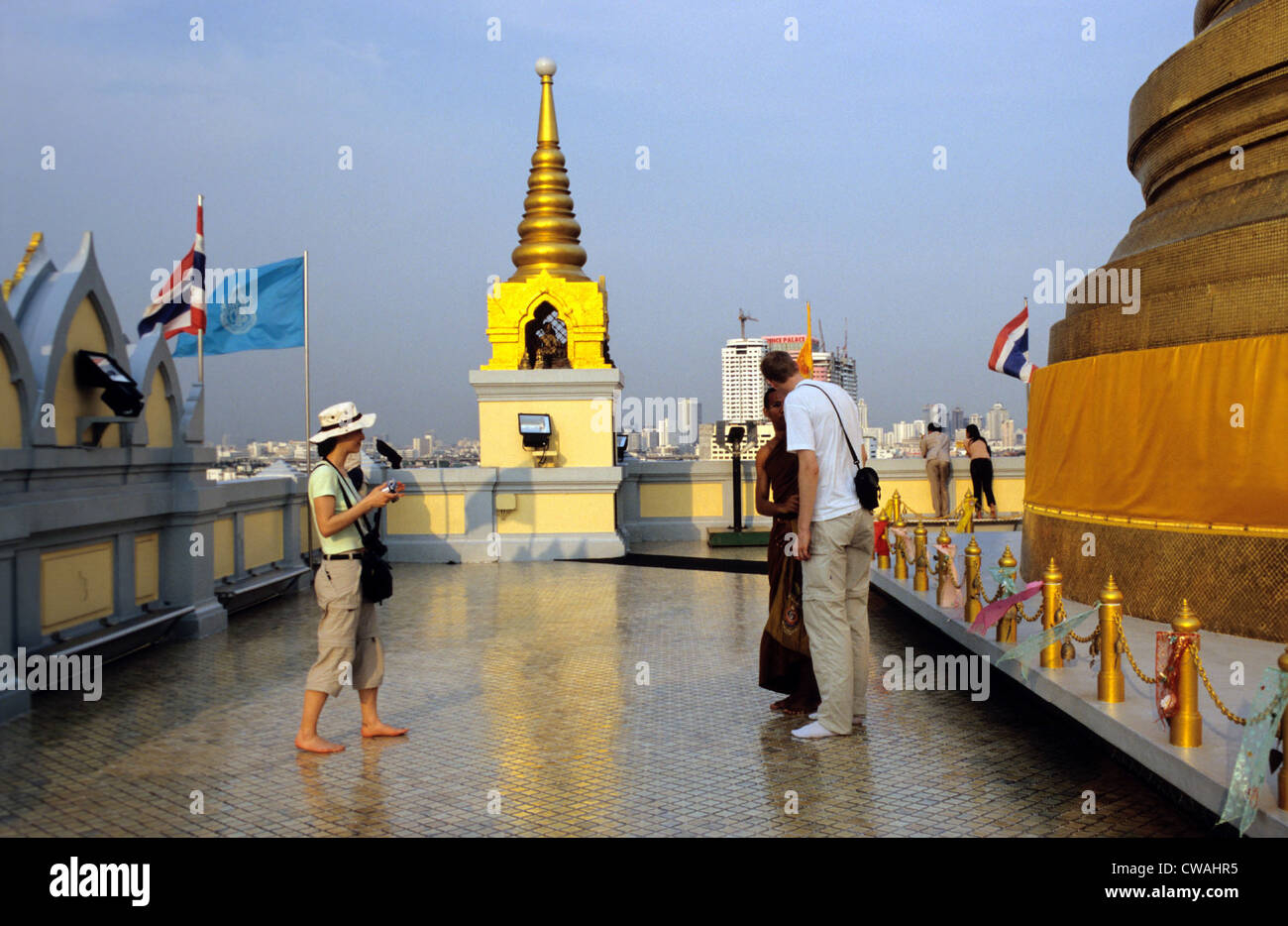 Bangkok, tourists in conversation with a monk Stock Photo