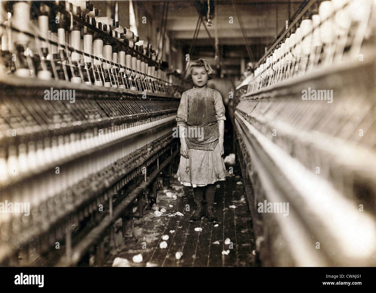 Child laborer portrayed by Lewis Hine in 1909.  Little spinner who regularly worked in cotton mill in Augusta, Georgia. Stock Photo