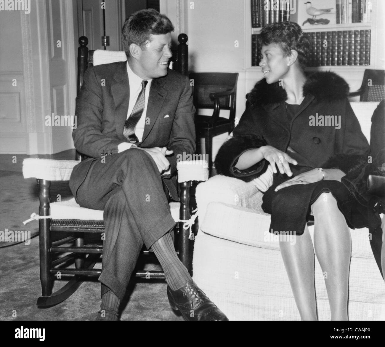 Wilma Rudolph (1940-1994) chats with President Kennedy at the White House. She was the first African American women to win Stock Photo
