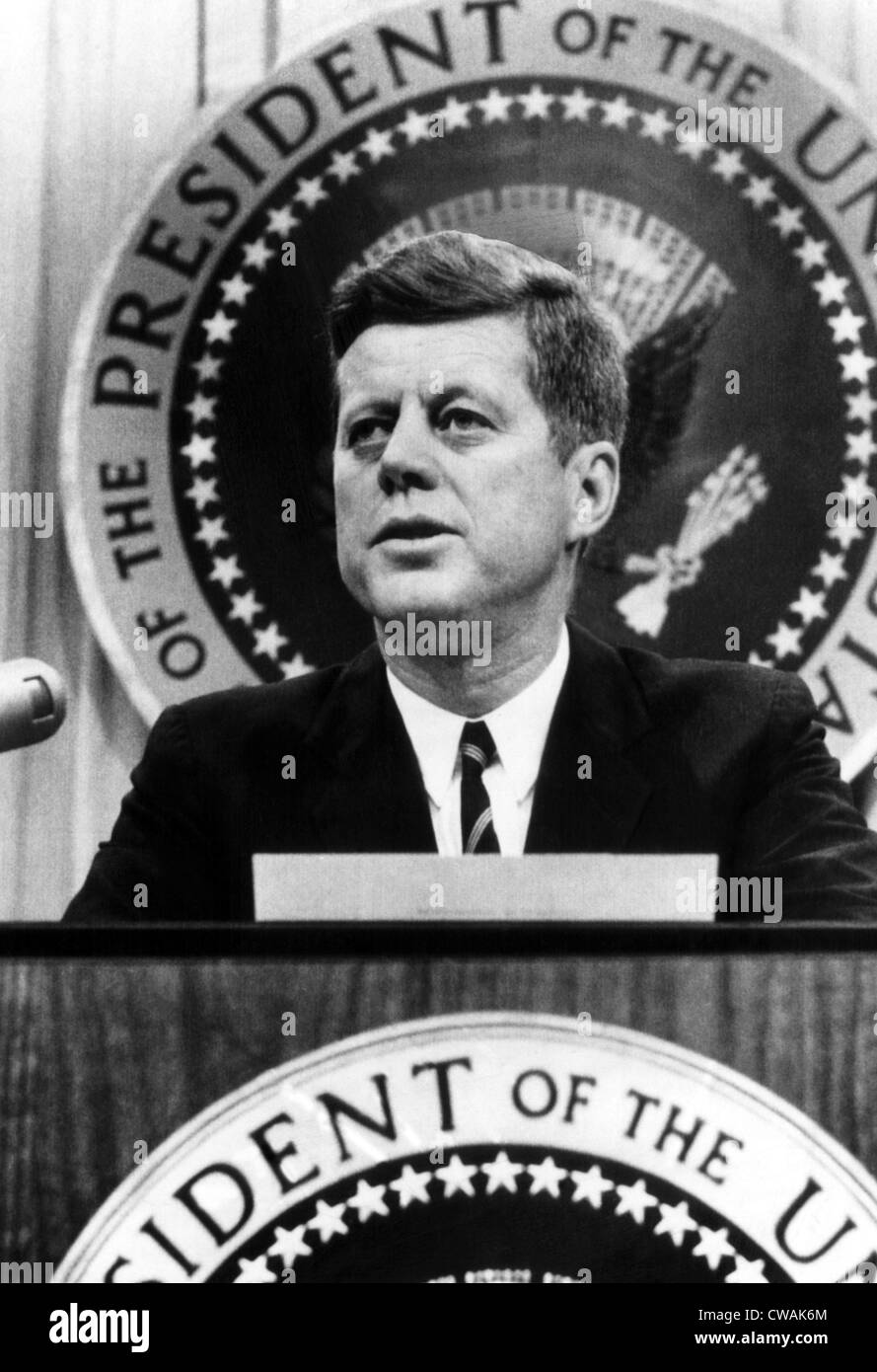 John F. Kennedy, tells a news conference that he has been informed that Soviet jet bombers will be removed from Cuba. He will, Stock Photo