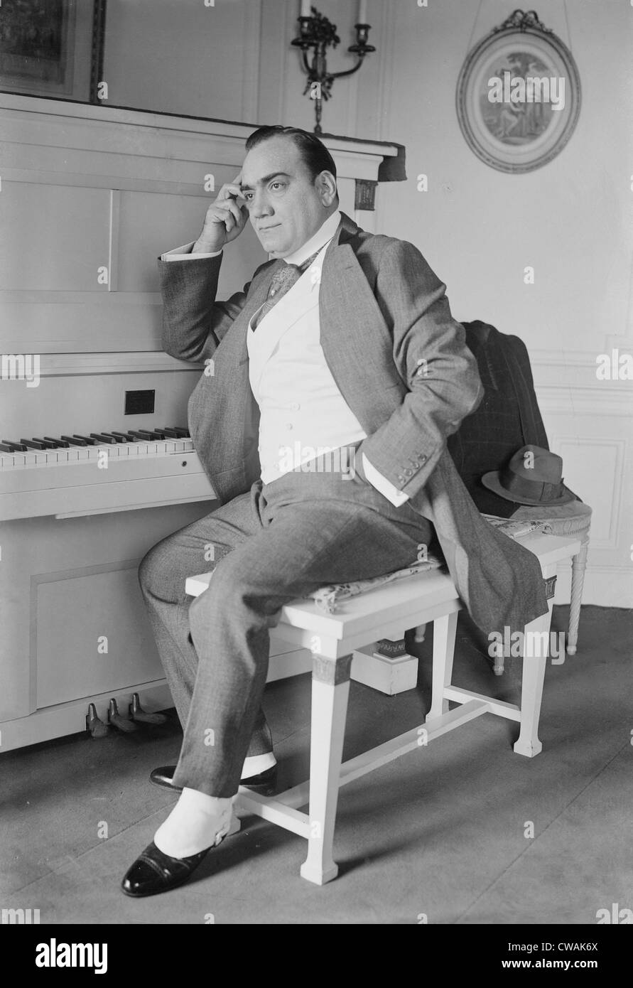 Enrico Caruso (1873-1921) seated at the piano in his New York apartment. Ca. 1915. Stock Photo