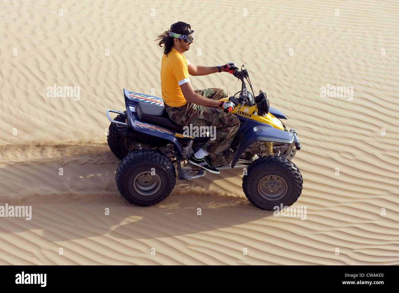 Dubai, quad riders in the desert Stock Photo - Alamy