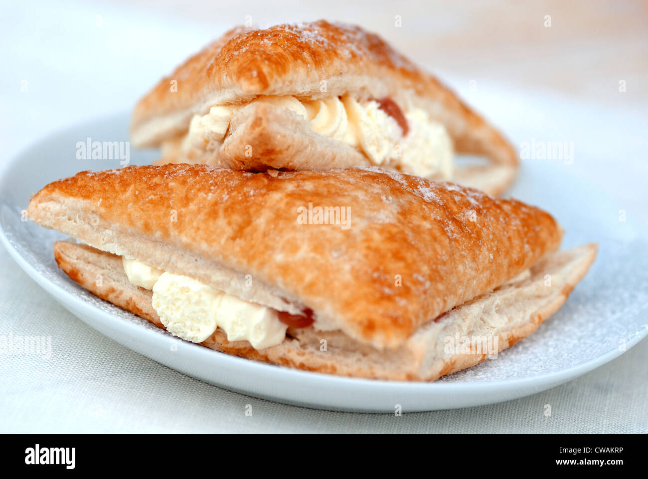 cream bun against a neutral background Stock Photo