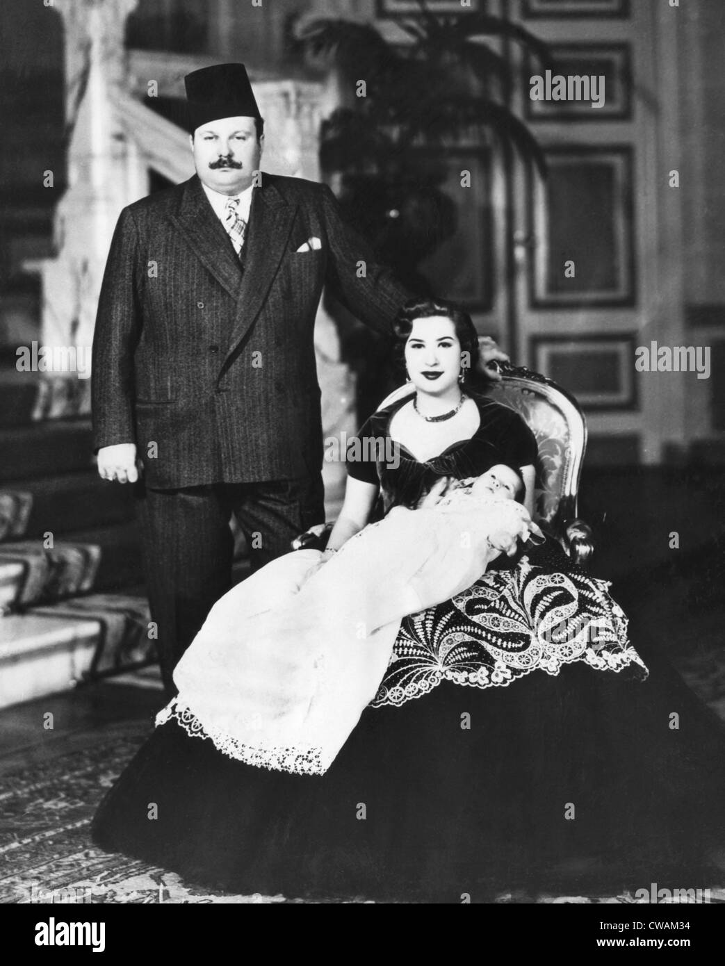 King Farouk of Egypt (1920-1965), Queen Narriman (holding Prince Ahmed Fouad), Cairo, Egypt, March 29, 1952.. Courtesy: CSU Stock Photo
