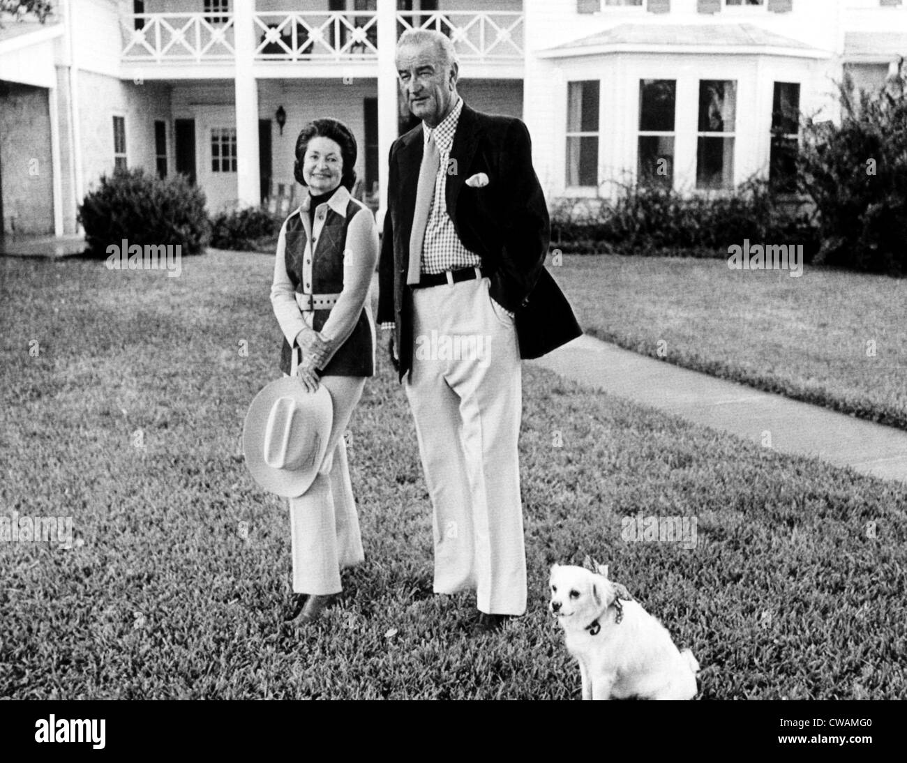 Lady Bird and Lyndon Johnson with their dog, Yuki, pose on the front lawn of LBJ Ranch in connection with their 38th Wedding Stock Photo