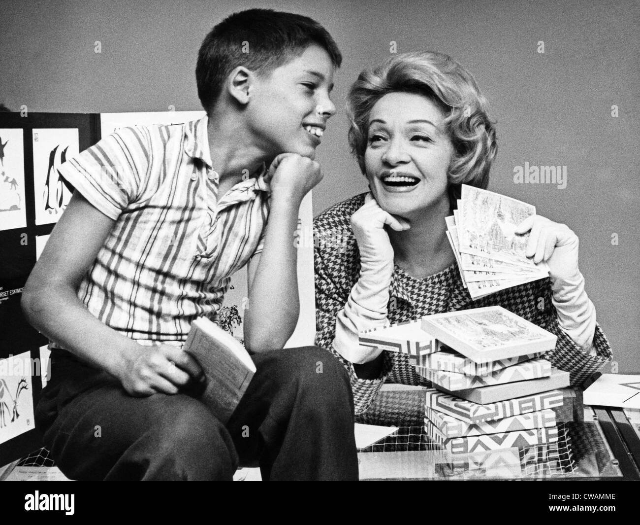 Marlene Dietrich sells a boy Christmas cards at a UNICEF fundraiser, 1961. Courtesy: CSU Archives/Everett Collection Stock Photo