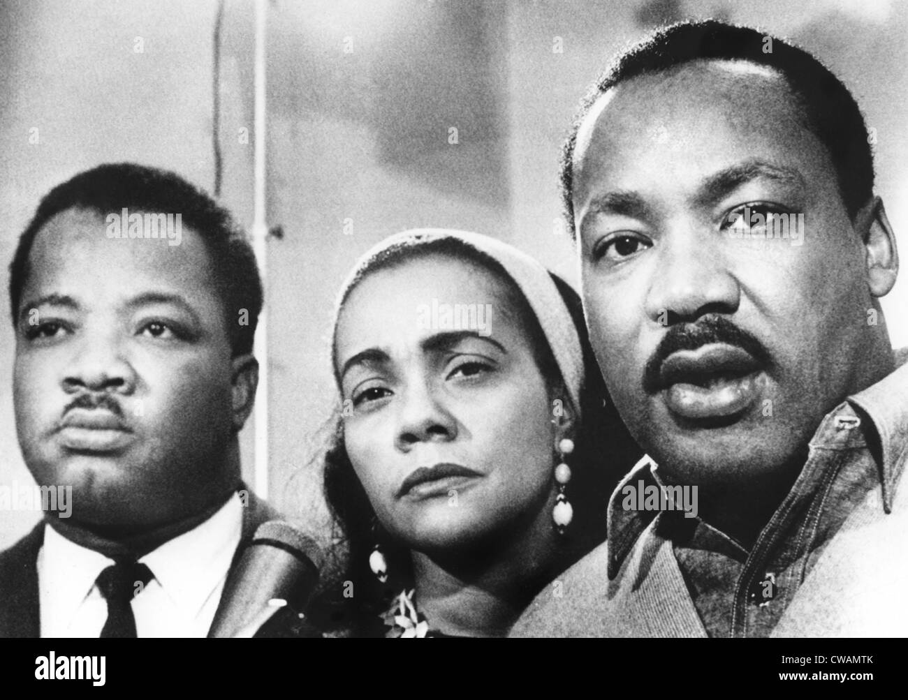 Dr. Martin Luther King (right), with his wife, Coretta Scott King (center), and brother, Rev. A.D. King, answering journalist's Stock Photo