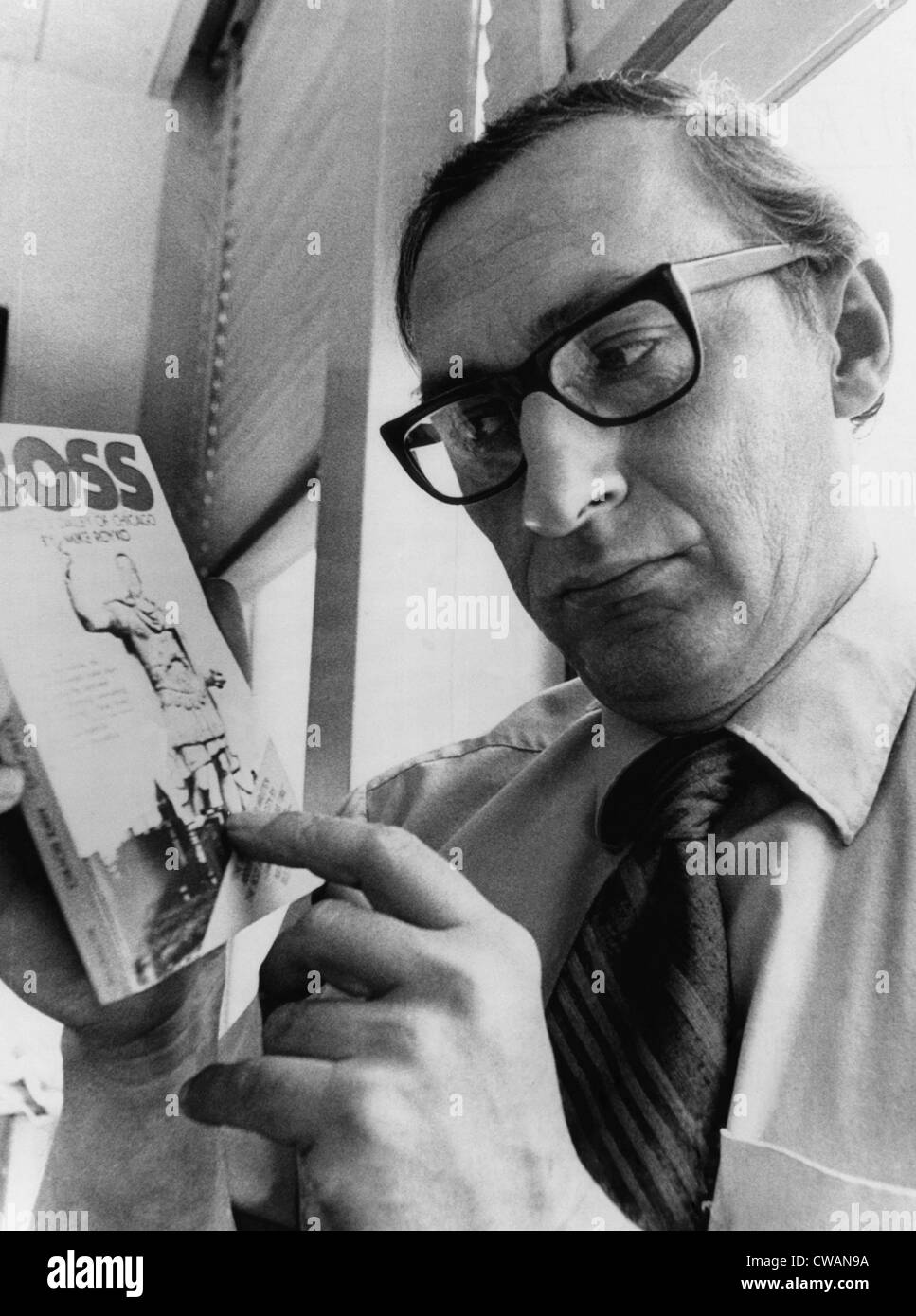 Chicago Daily News columnist Mike Royko, (1932-1997), with a copy of his book 'Boss', 1971.. Courtesy: CSU Archives / Everett Stock Photo