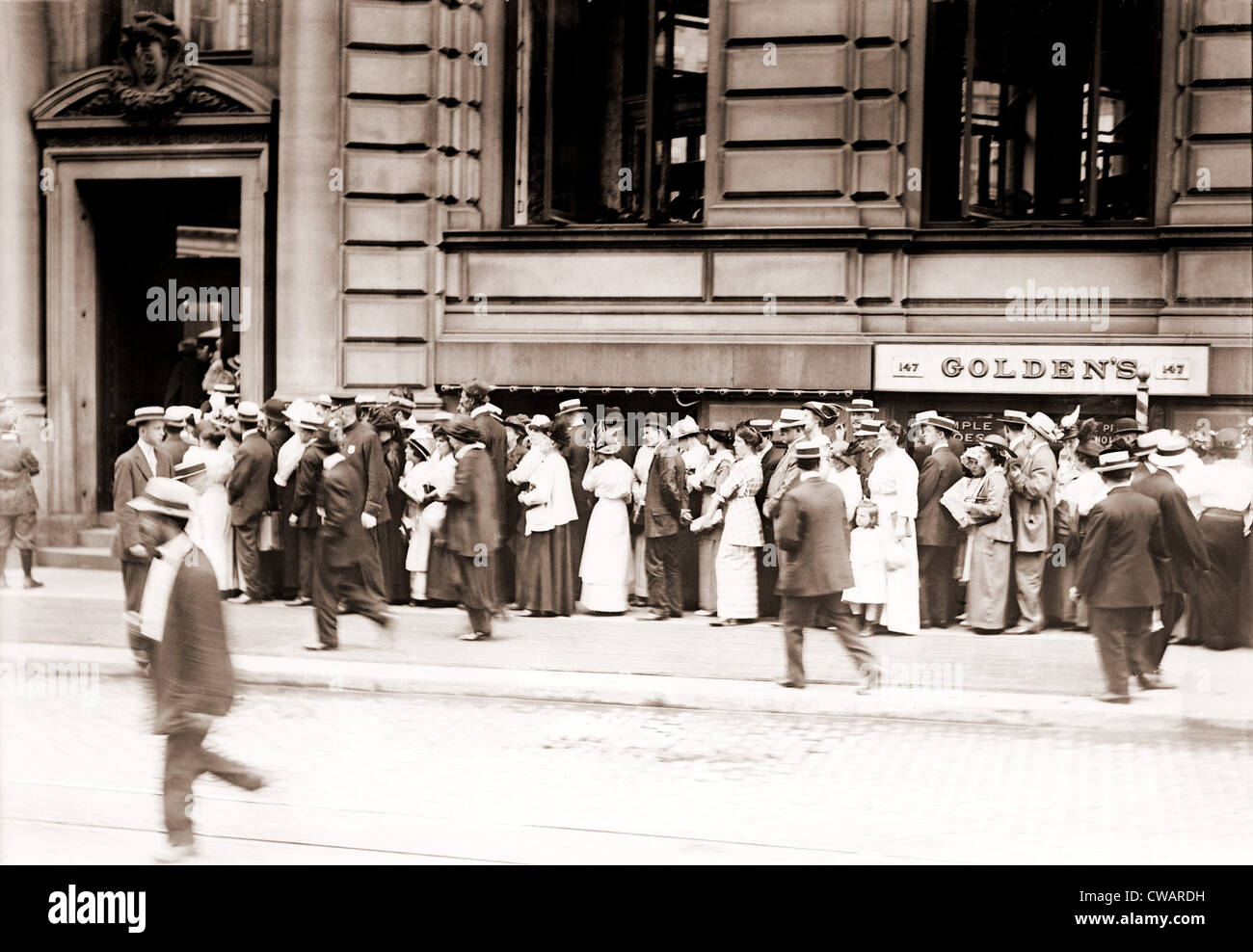 A long line of men and women line up in a run on the German American Bank of New York City.  Ca. 1905-1915. Stock Photo