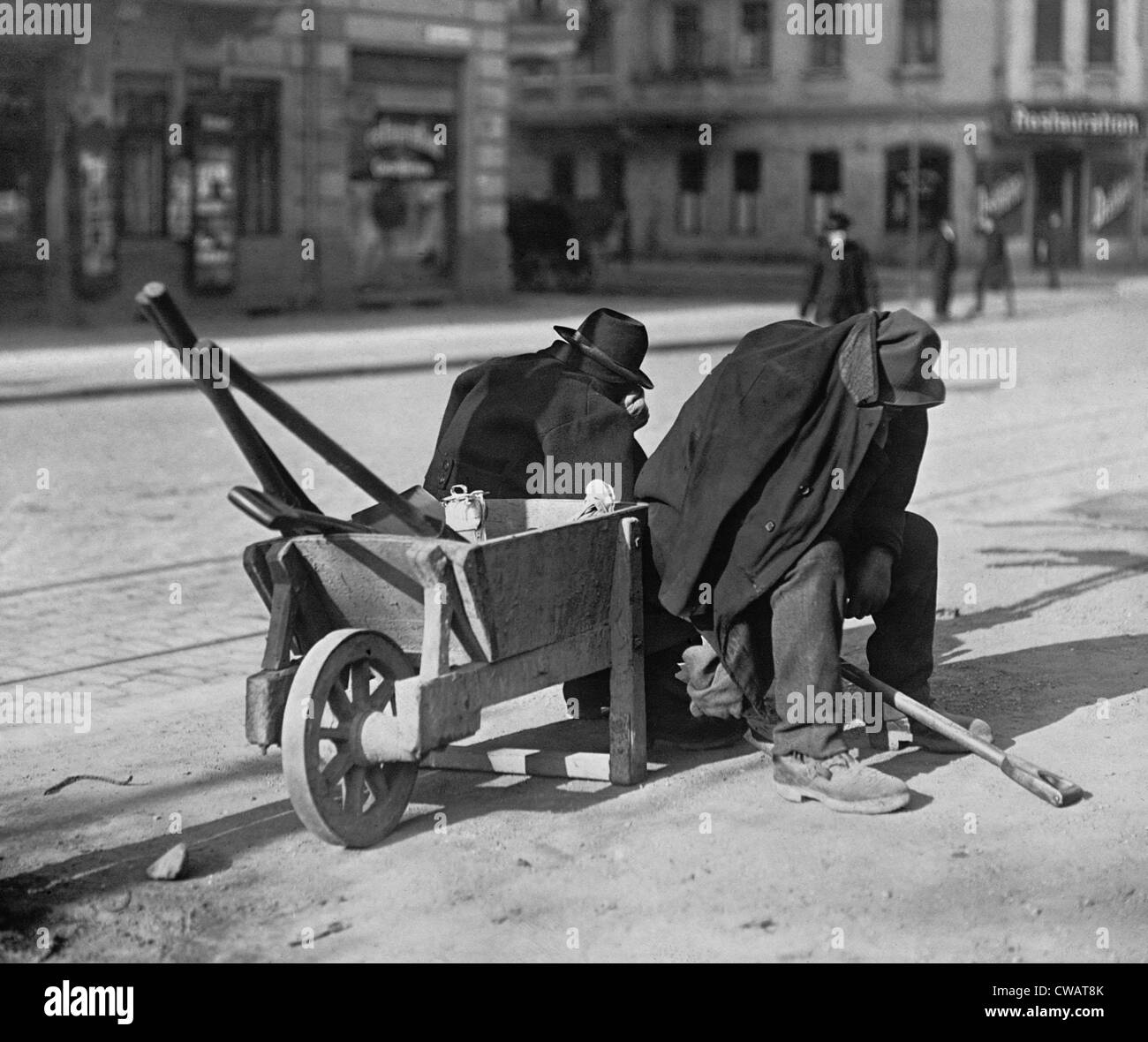German street sweepers taking lunchtime nap.  Wartime and defeat took a terrible economic toll on Germany. Ca. 1919. Stock Photo
