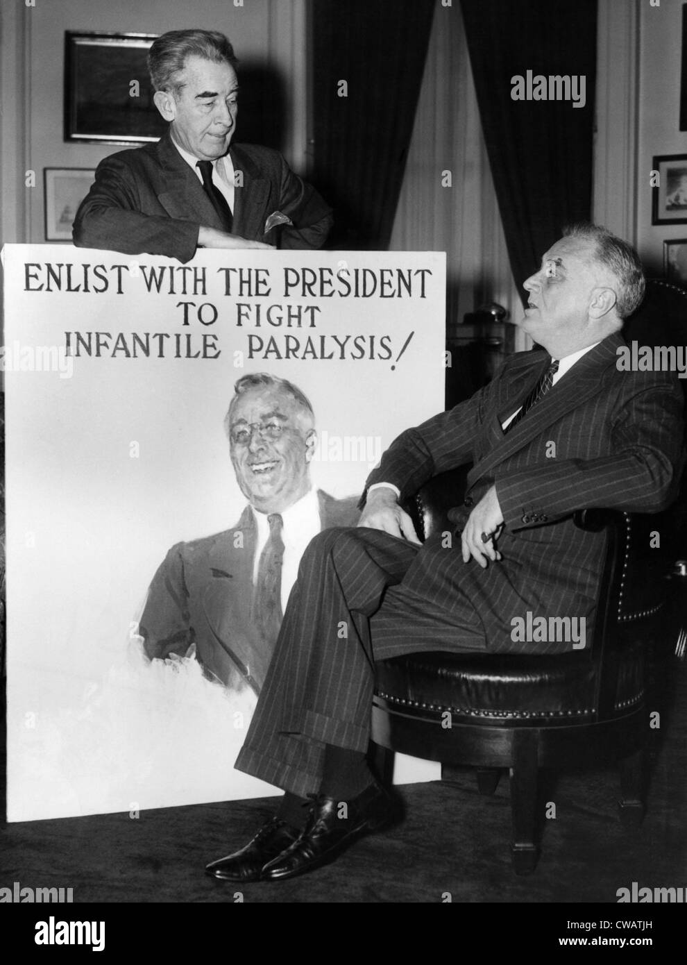 James Montgomery Flagg presents President Roosevelt with the first campaign poster in the fight against infantile paralysis on Stock Photo