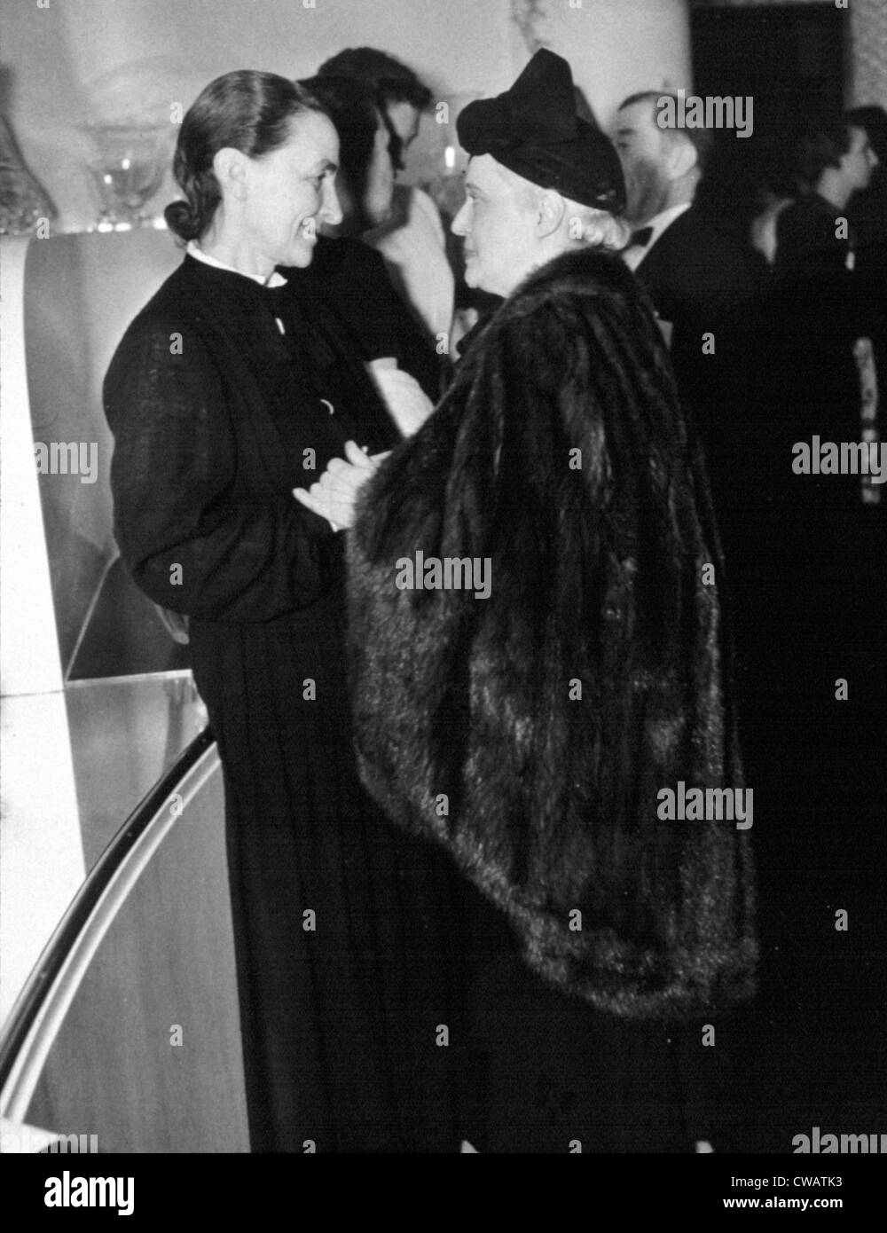 GEORGIA O'KEEFFE, greeting Mrs. Chester Dale, a well-known art collector, January, 1940.  Photo courtesy: Everett/CSU Archives. Stock Photo