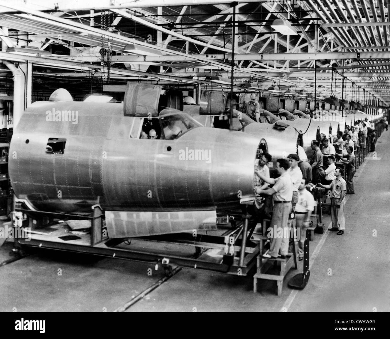 Men assemble aircraft at a Chrysler bomber plant, 1943. Courtesy: CSU Archives/Everett Collection Stock Photo