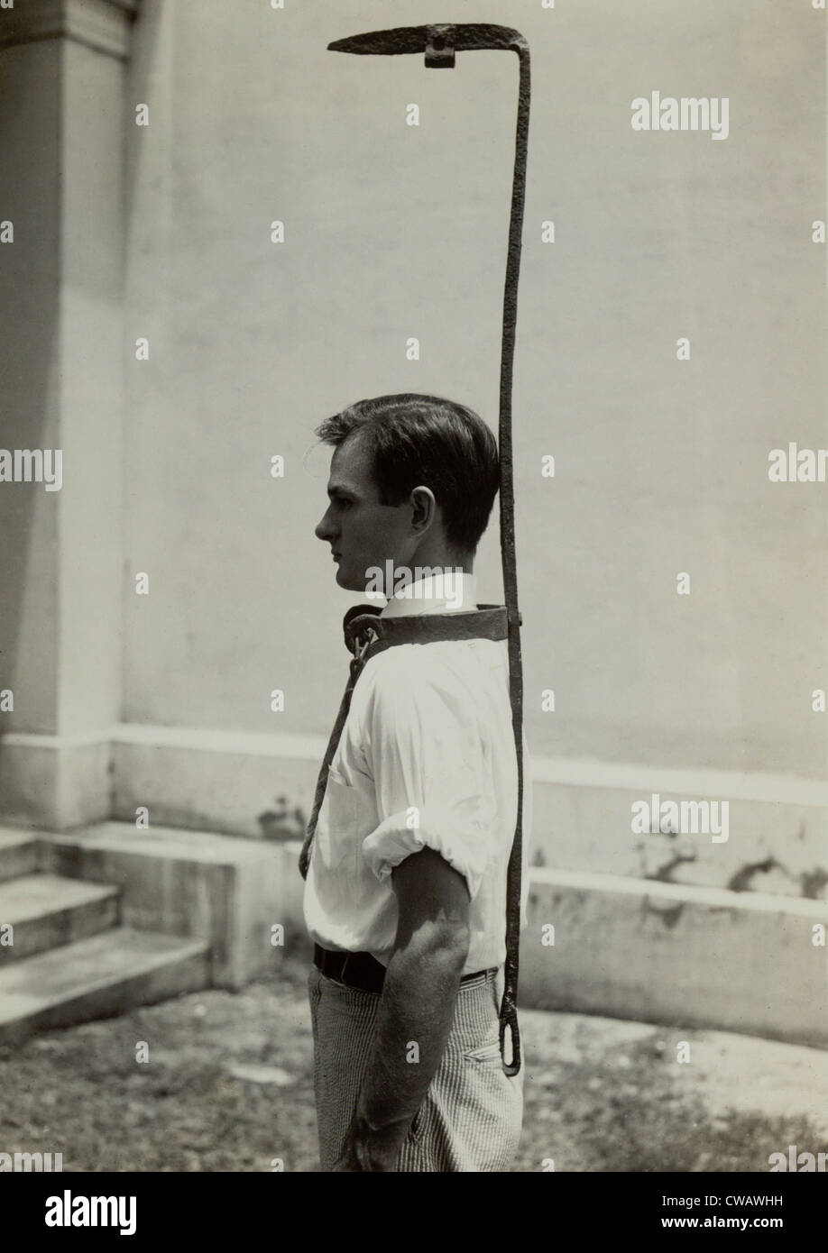 Model wears a slave bell rack, a used slave owners to handicap a runaway slave.  Originally topped by a bell which rang when Stock Photo