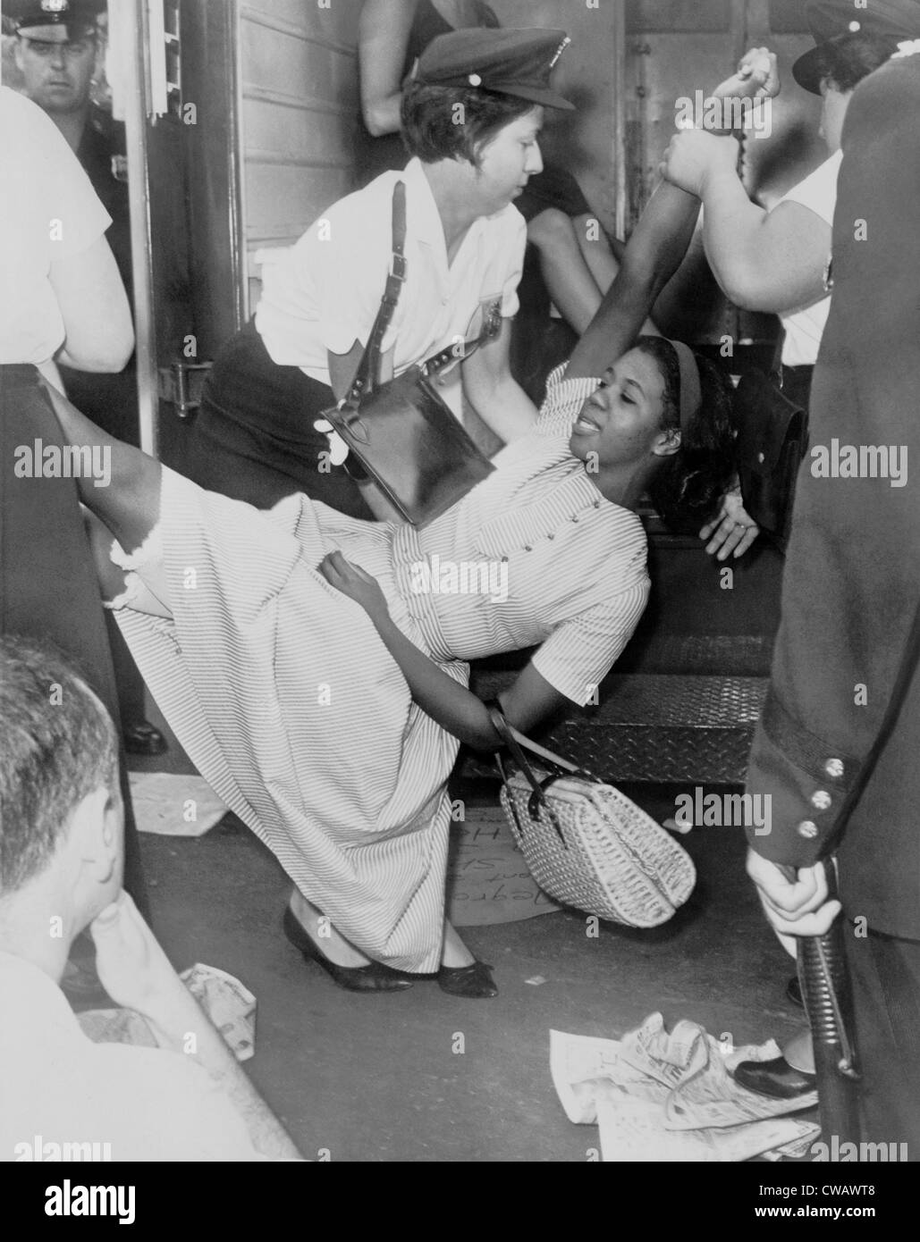 African American woman resisting her arrest as she is carried to a paddy wagon during a civil rights demonstration in Brooklyn, Stock Photo