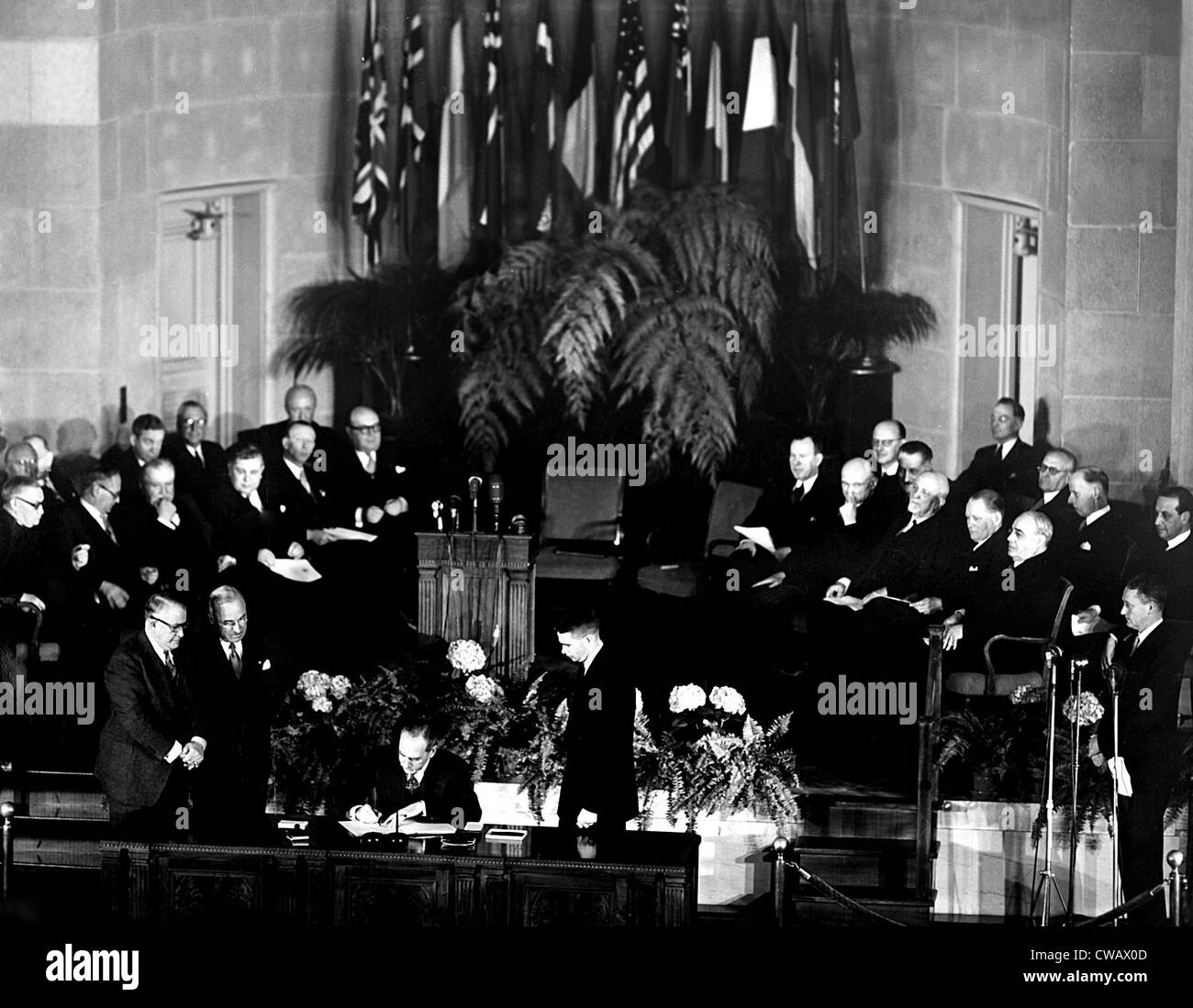 NATO, President Truman and V.P. Barkley, look on as Secretary of the ...