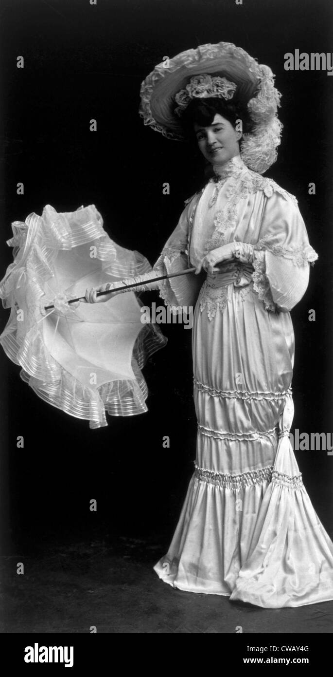 Woman wearing an 1890s dress and parasol; photo taken 1915. Photo: Courtesy Everett Collection Stock Photo