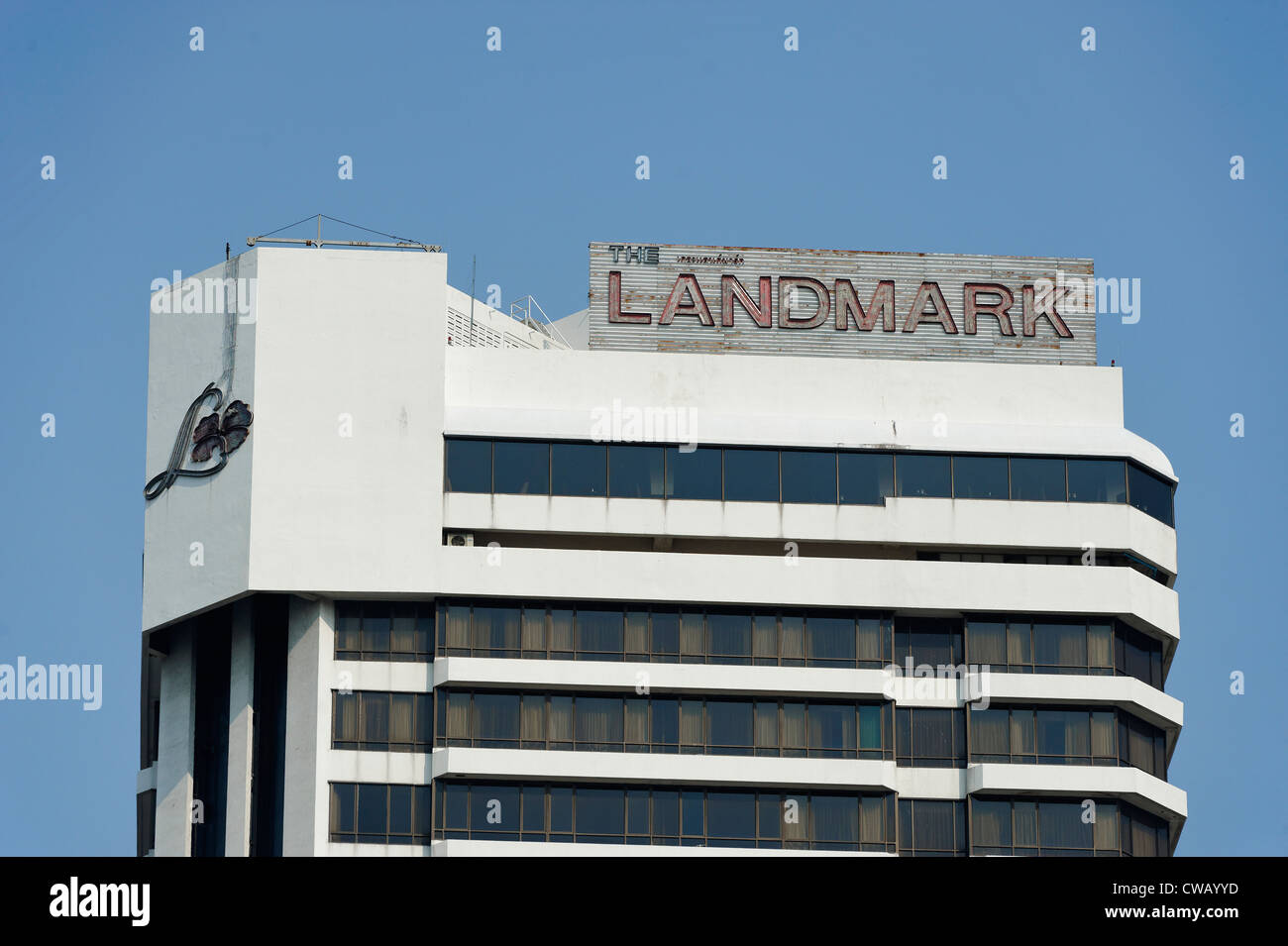 Roof of the landmark Hotel in Bangkok with the sign looking worn and shabby Stock Photo