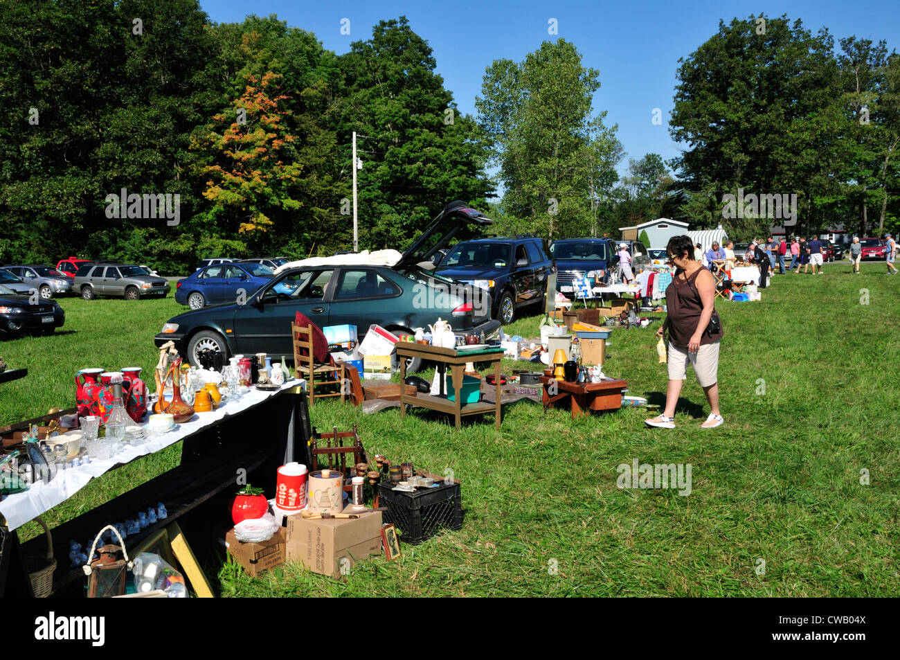 Shopper checks out merchandise at a tag sale in the Berkshires Stock