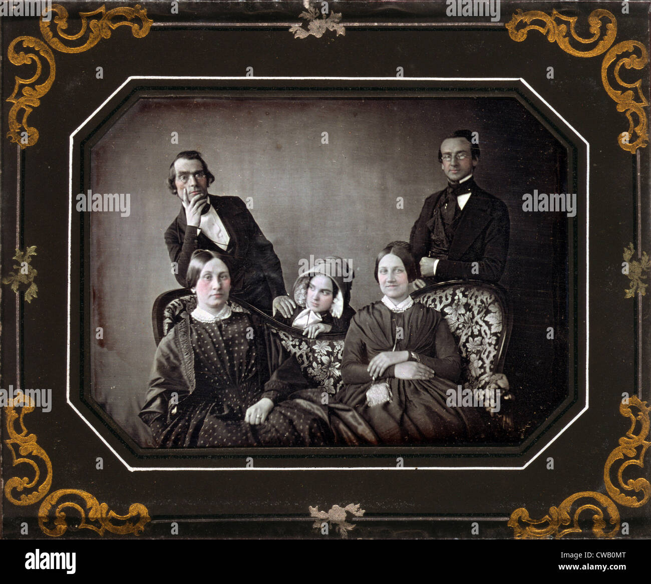Three women and two men and a sofa, hand painted quarter-plate daguerreotype, circa 1840-1860. Stock Photo