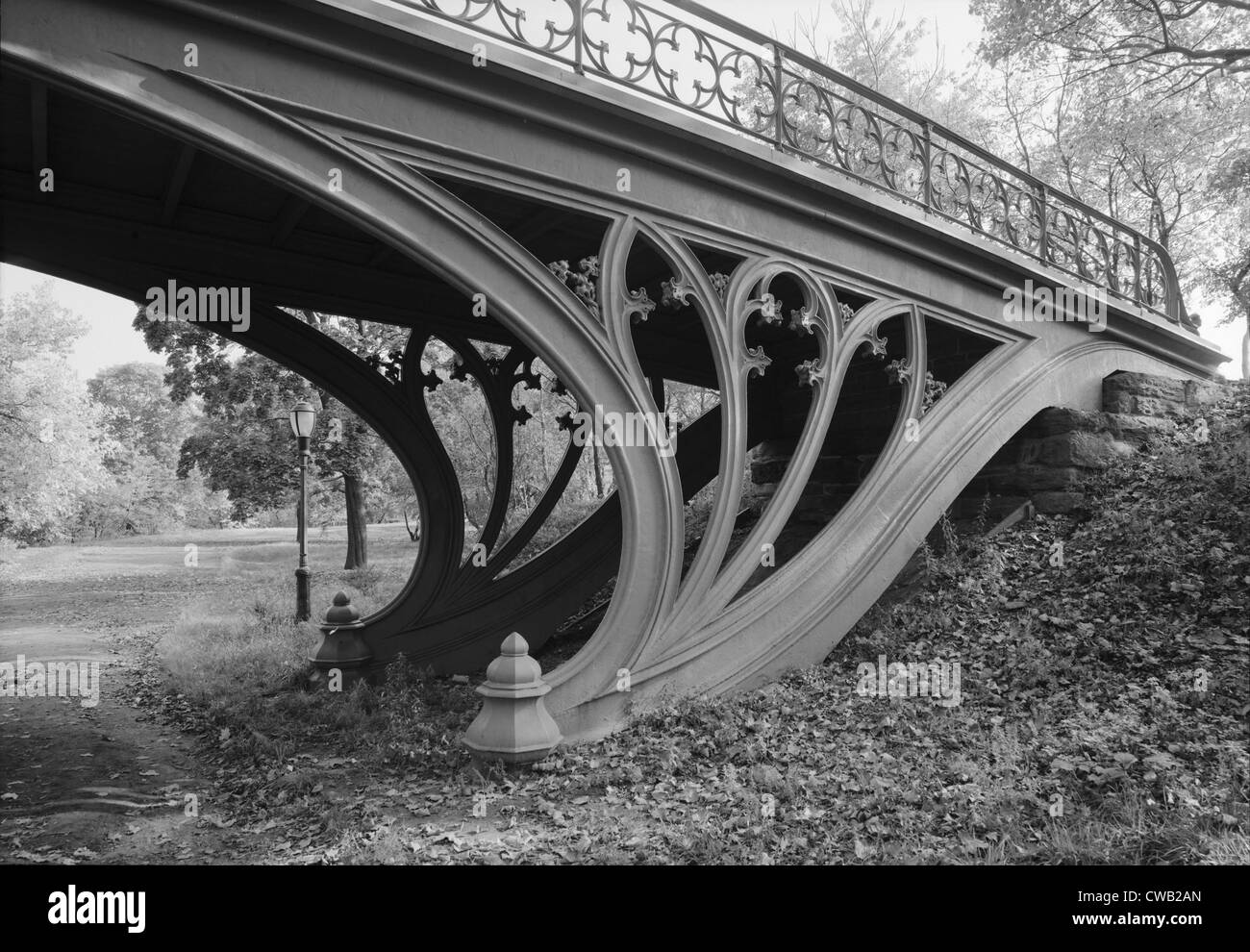 New York City, Central Park's Gothic Arch, view from bridlepath looking northeast showing detail of cast-iron gothic motifs in Stock Photo