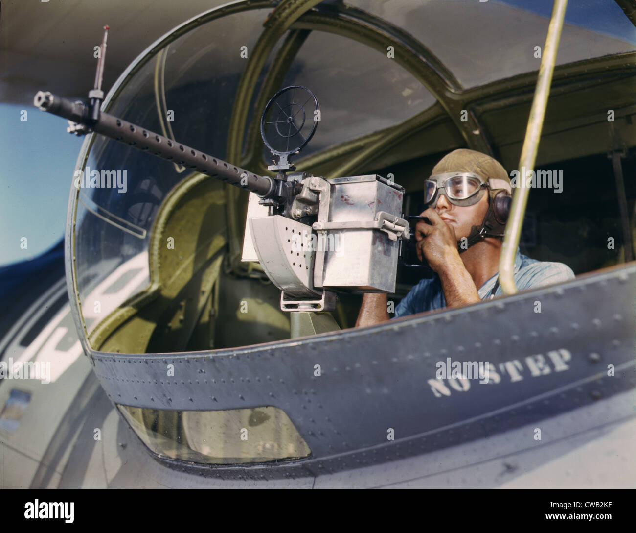 World War II, Jesse Rhodes Waller, A.O.M. third class, tries out a 30-calibre machine gun he has just installed on a Navy Stock Photo